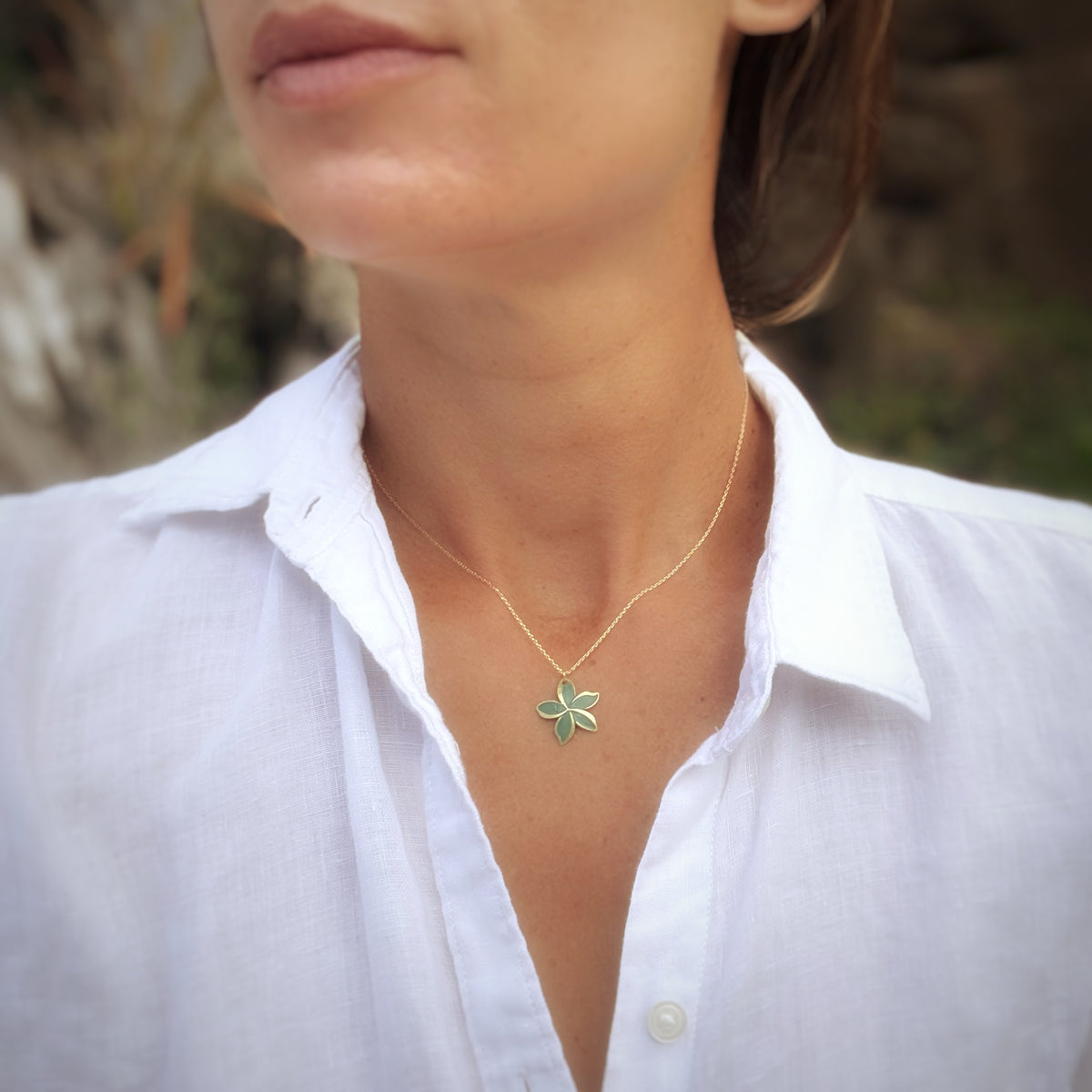 Leighton Lam Designs Pikake Patina Holiday jewelry set featuring earrings and necklace with floral and patina finish.