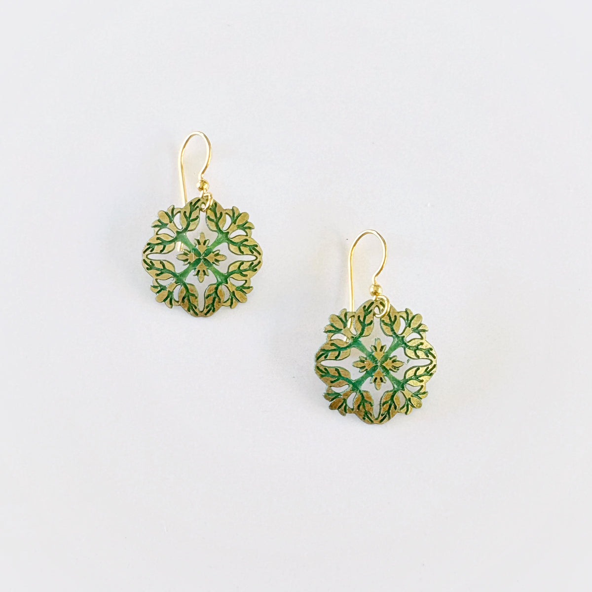 Leighton Lam Designs Pikake Patina Holiday Set featuring crafted jewelry pieces with a patina finish and festive design elements.