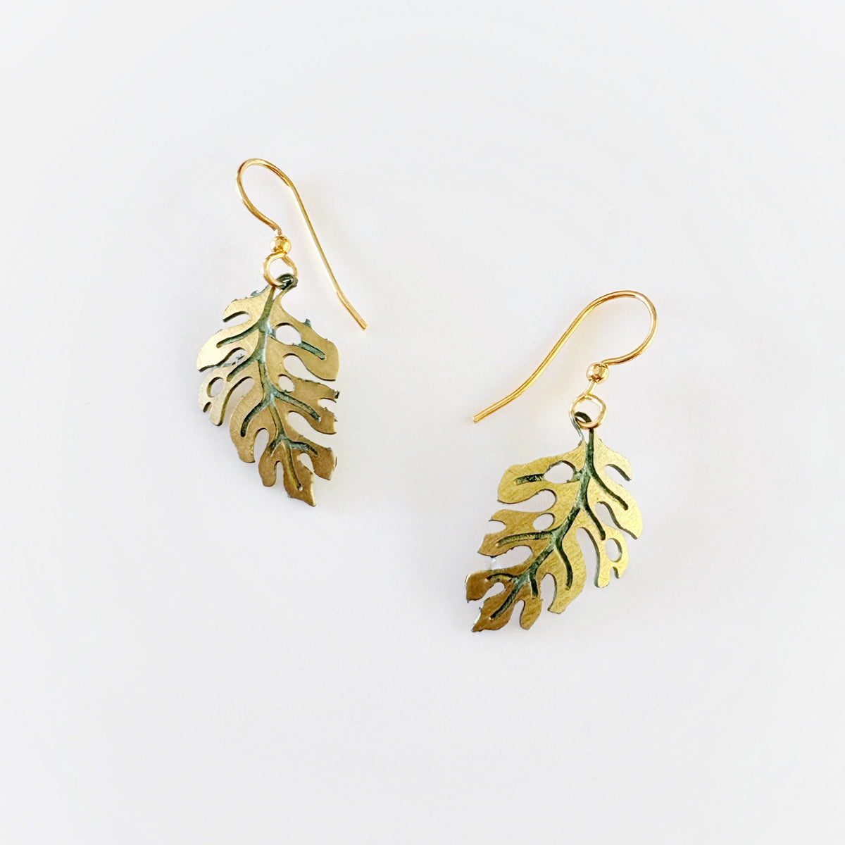 Leighton Lam Designs Monstera Patina Holiday Set featuring botanical-inspired jewelry with green patina accents and intricate leaf designs.