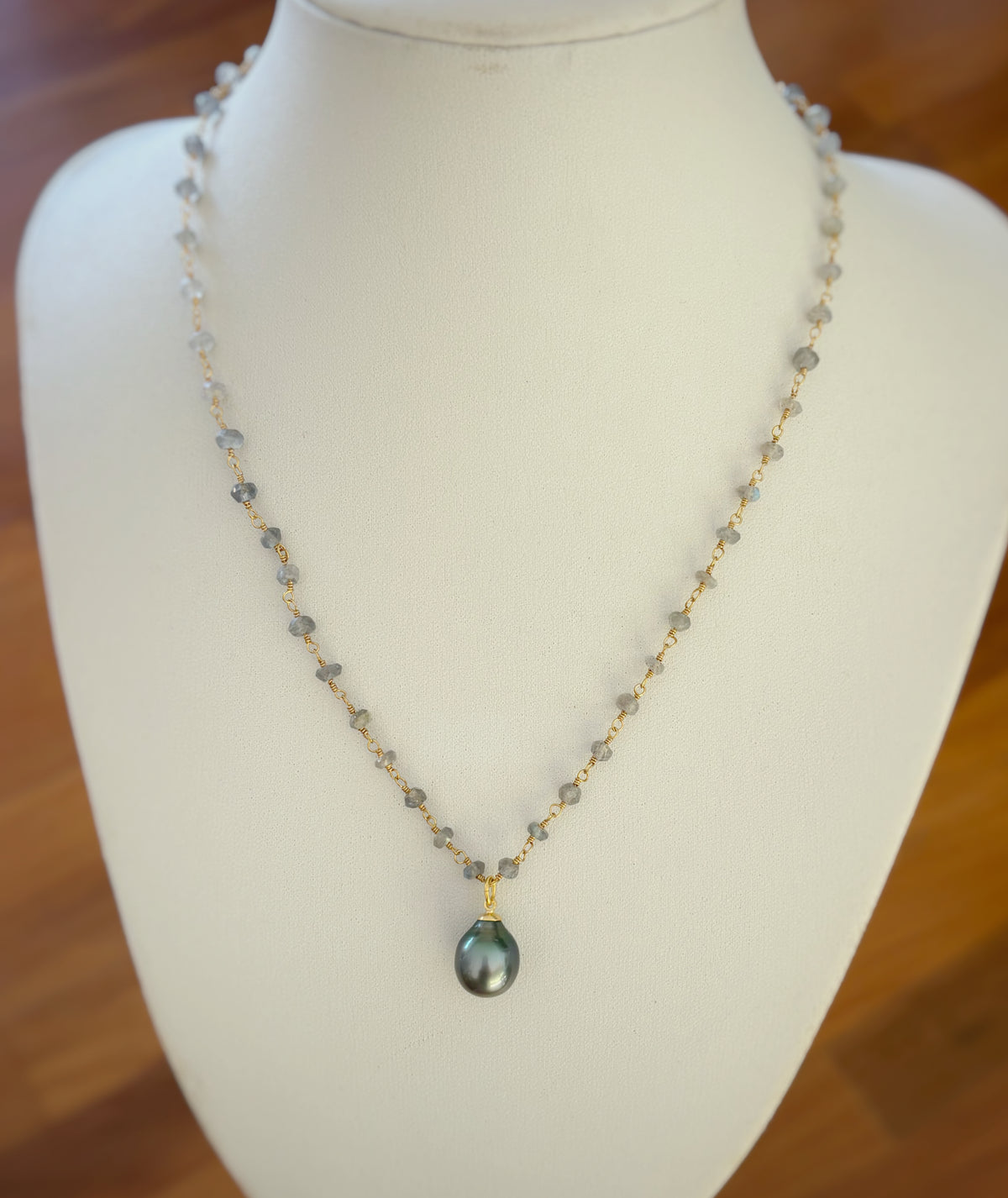 Labradorite and Tahitian pearl necklace by Leighton Lam Designs featuring dark pearls and iridescent labradorite stones.