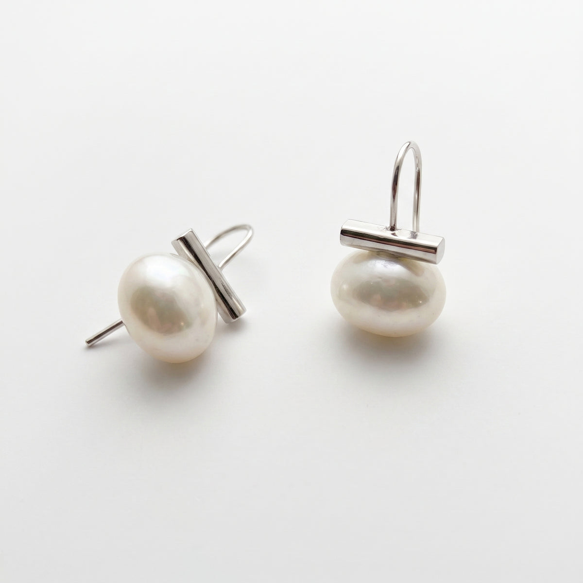 Leighton Lam Designs Ohelo Pearl Earrings featuring silver hoops with elegant white pearls, stylish jewelry for women